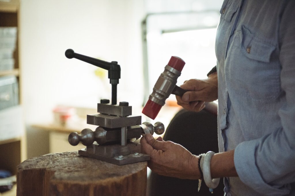 close up of craftswoman working in workshop