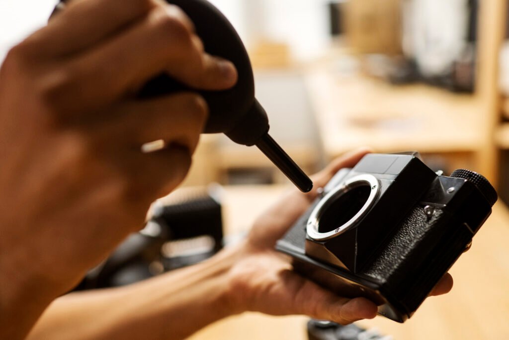 side view hands repairing photo camera